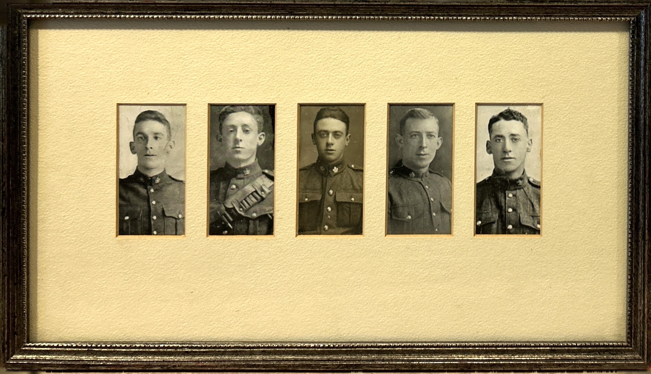 Close up portraits of five soldiers in uniform, placed within a white background.